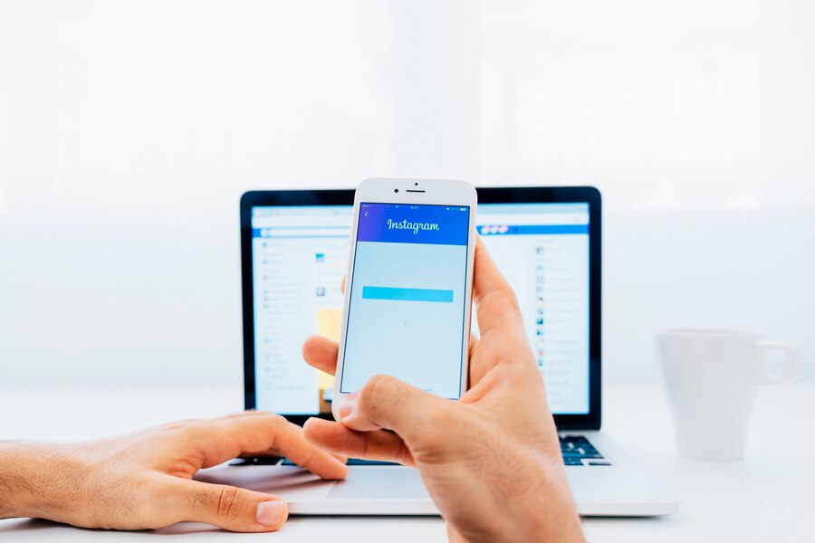 facebook phone in front of the computer